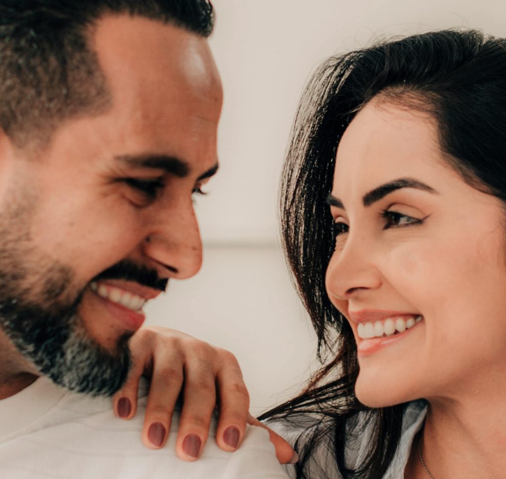 couple with pretty smile looking at each other